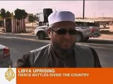 Libya rebels battle Gaddafi loyalists