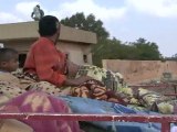 Libyan rebels, civilians flee Ajdabiya in thousands