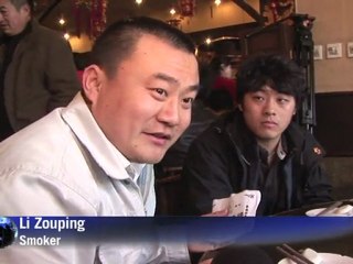 Arabic-Web-China's delayed smoking ban to start May 1