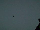 Black disc-shaped UFO over UK 10-Apr-2011