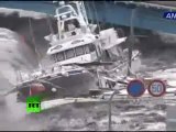 New dramatic video_ Tsunami wave spills over seawall, smashes boats, cars