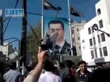 Syrian people tearing photos of  Bashar Al-assad.