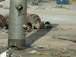 Massive chimney demolished by trucks