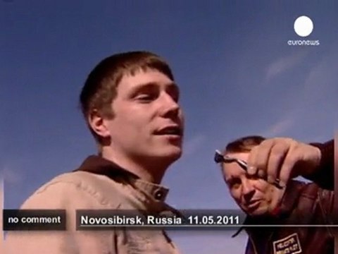 Russian stuntman does tricks with his chopper - no comment