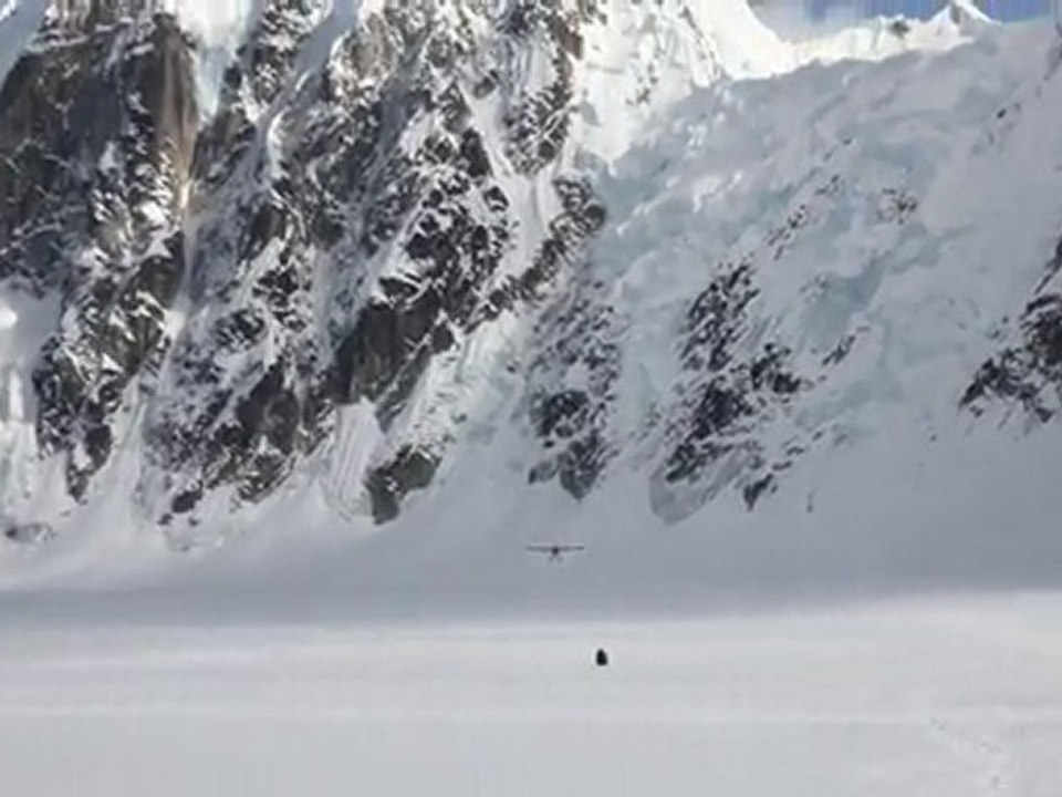 Plane landing on Ruth Glacier at the base of Peak 11,300 (Alaska)