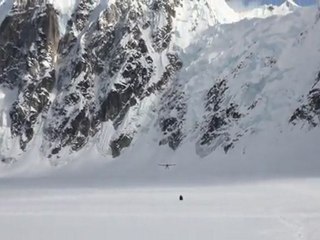 Plane landing on Ruth Glacier at the base of Peak 11,300 (Alaska)