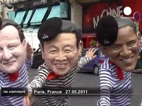 Effigies of G8 leaders can-can in Paris protest - no comment