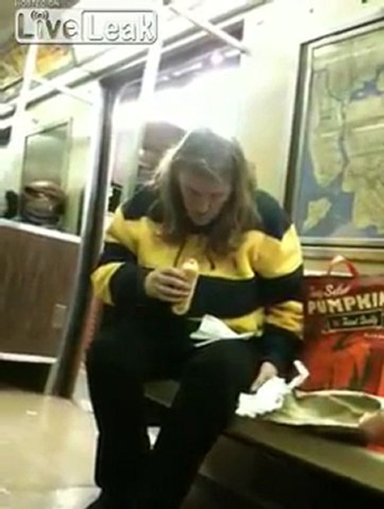 Woman Eating a Hotdog on Subway