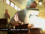 Libyan rebels build weapons in makeshift... - no comment