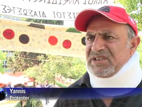 Greek premier hails tight austerity victory despite protests