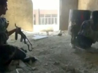 Smoke on the horizon and gunfire in the streets of Syria