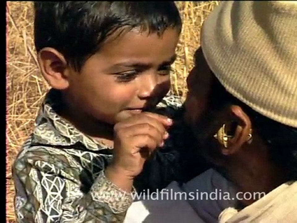 Boy playing with moustache