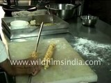 Indian food being prepared and served