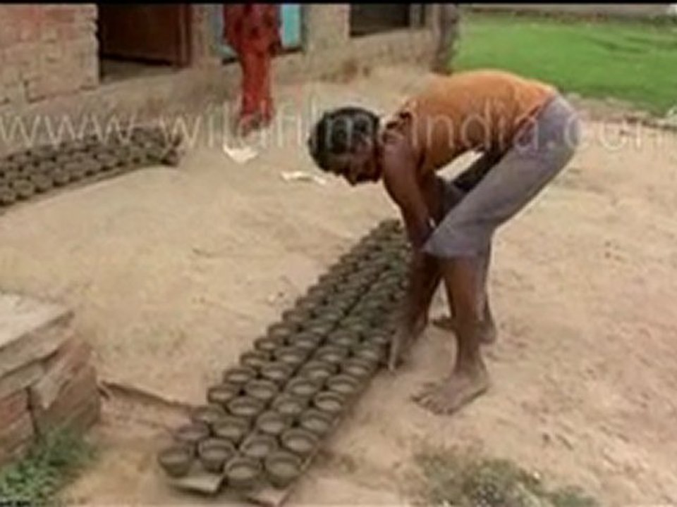 Potter making clay items