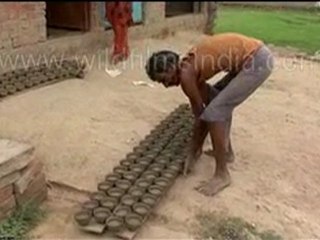 Potter making clay items