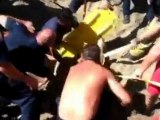 Teenager rescued after beach hole collapses