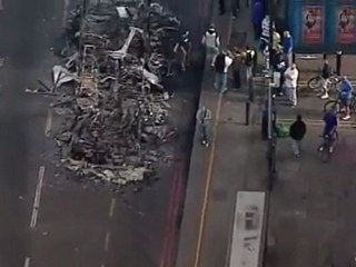 UK fights fires, controls riot damage