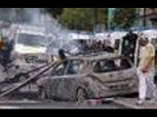 London riots: bleeding boy robbed by passers-by -