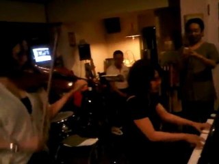 Nice moment, a mother and her daughter playong together... Piano and violin !