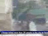 More than 20 dead as Syrian troops blast city