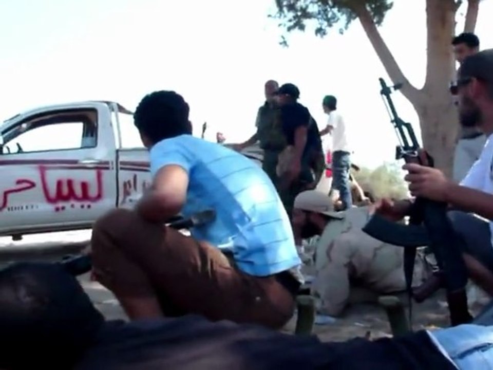 Libyan rebels under sniper fire on road to Tripoli