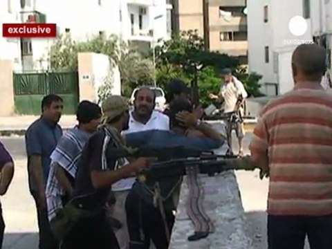 Battle rages for Tripoli as rebels meet resistance