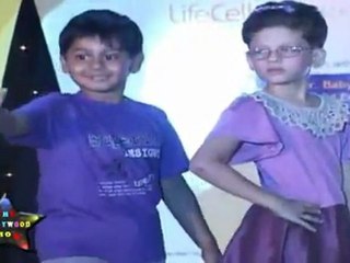 Sexy Babe With Sweet Kid Walks On Ramp At Morther&Baby Fashion Show