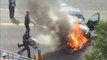 Raw Video: Burning Car Lifted Off Trapped Man