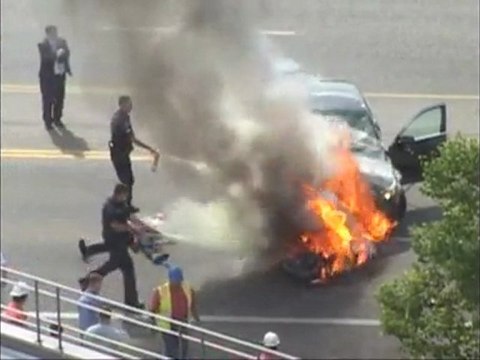Raw Video: Burning Car Lifted Off Trapped Man
