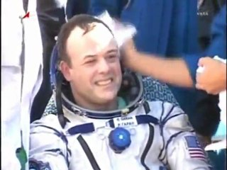 US - Russian space trio land