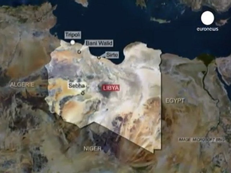 Libyan forces renew fight for Gaddafi's last bastions