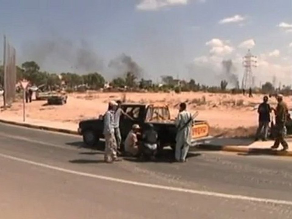 Libyan fighters storm Gaddafi's Sirte.