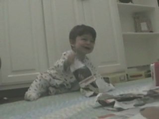 Laughing Baby Ripping Paper