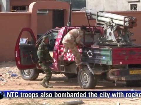 Fighting rages in 'final assault' on Kadhafi bastion