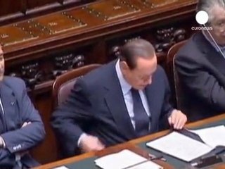Berlusconi scrapes through confidence vote