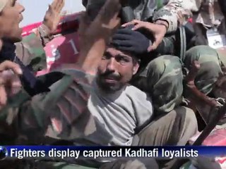 Libyan fighters celebrate after taking Bani Walid