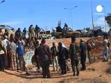 Jubilant Libyan fighters parade Gaddafi's body