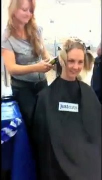 Policewoman's head shaved for $5500