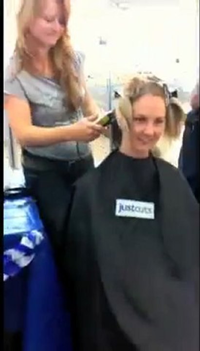 Policewoman's head shaved for $5500