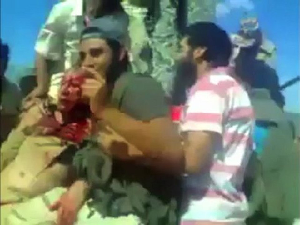 Dictator Moammar Gaddafi's Captured, Unconscious, In Slow Motion 10/20/2011