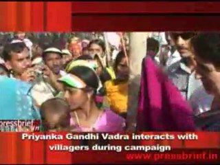 Priyanka Gandhi Vadra interacts with  villagers during campaign