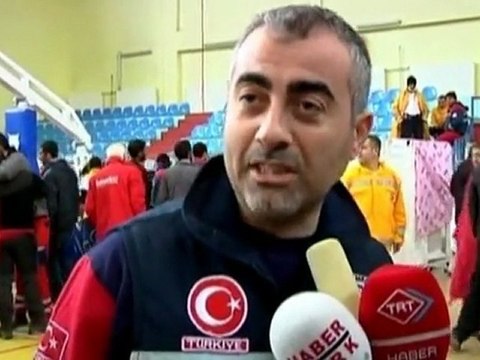 Mother and child reunion, pulled from rubble