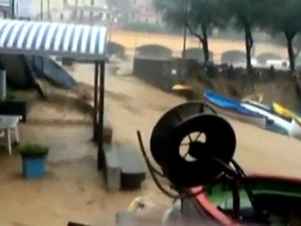 Cars and boats destroyed by heavy flooding in Italy