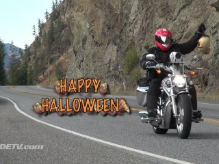 Halloween biker riding with head on a hook