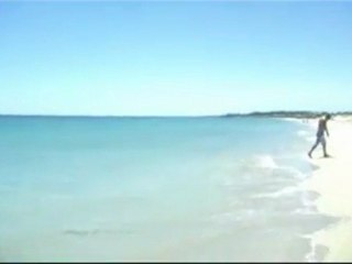 Sanshi playing the Didgeridoo at the Beach