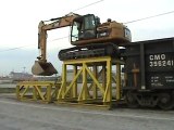 www.tarimdestek.net Cat 319D LN climbing onto rail car