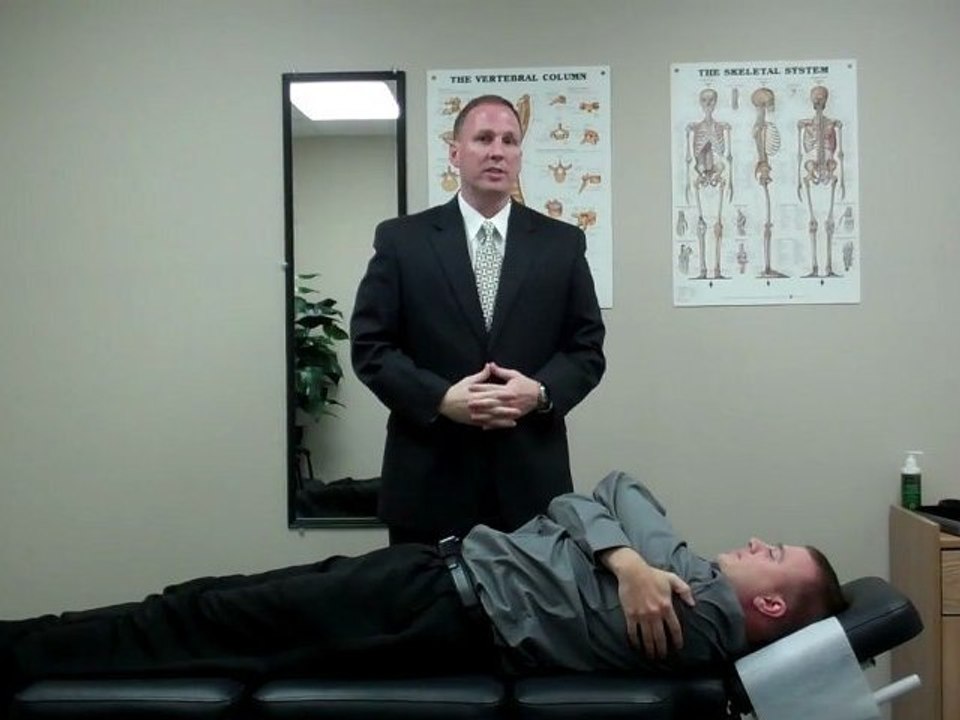 Bloomington IL Chiropractor performs Mid Back Pain Adjustment