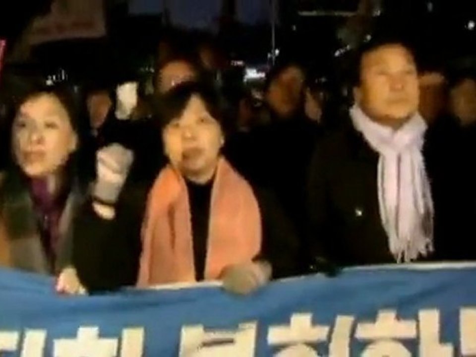Riot police scuffle with protesters