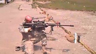 50 cal Barrett sniper rifle fired while kneeling