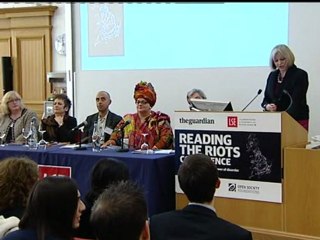 Theresa May heckled by riot crowd